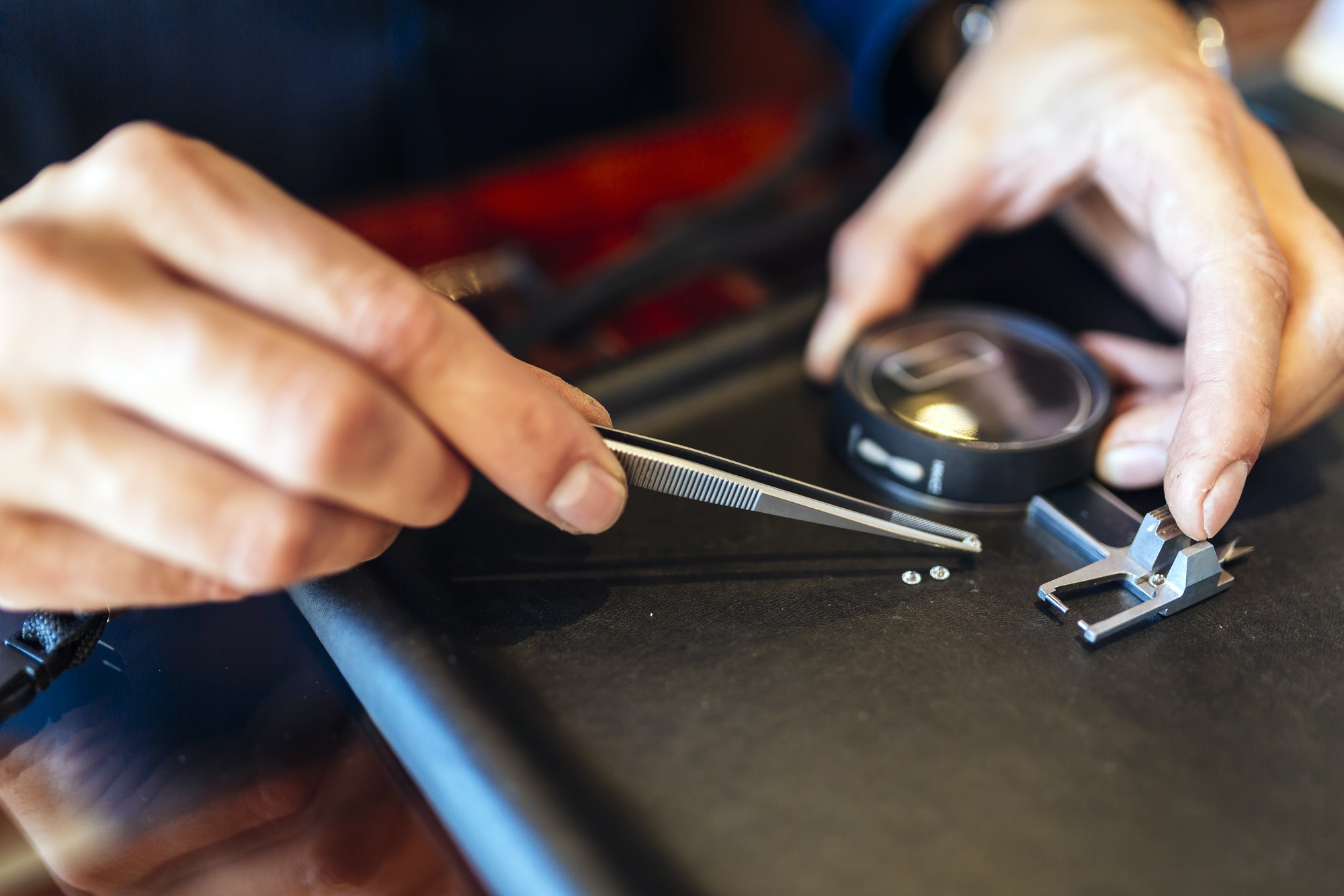 Jeweler checking size of diamond